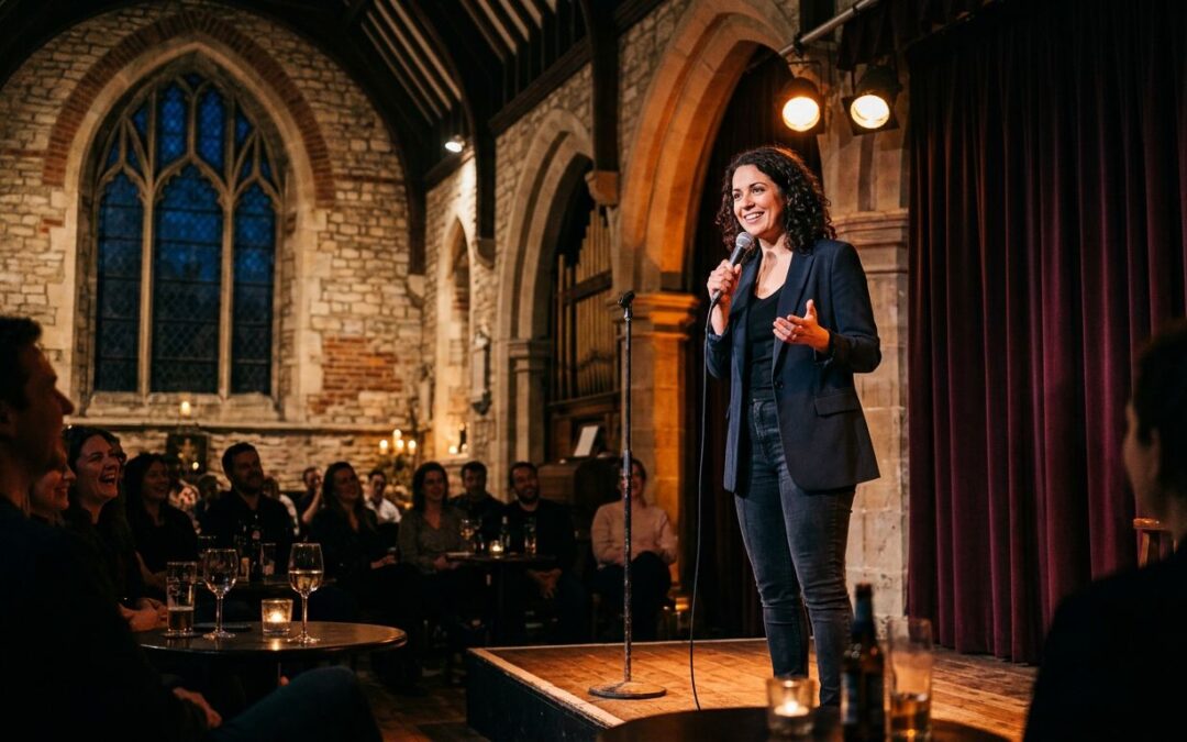 A comedian performs on a warmly lit stage inside a historic church.