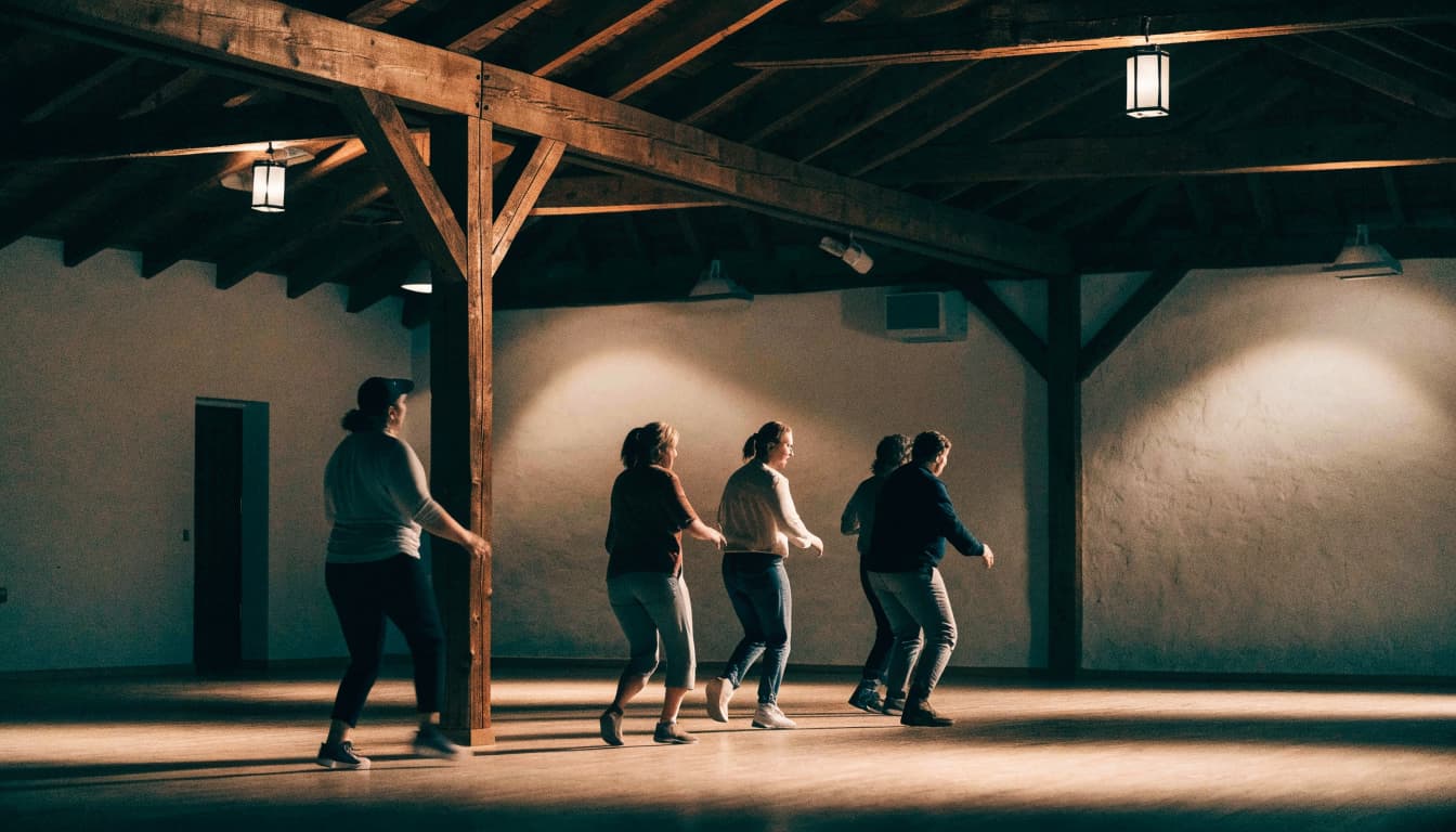 A group of adults line dancing in a rustic wooden hall.